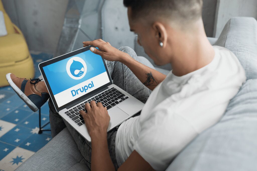 person using drupal on a laptop