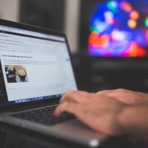 A person working on a website on a laptop