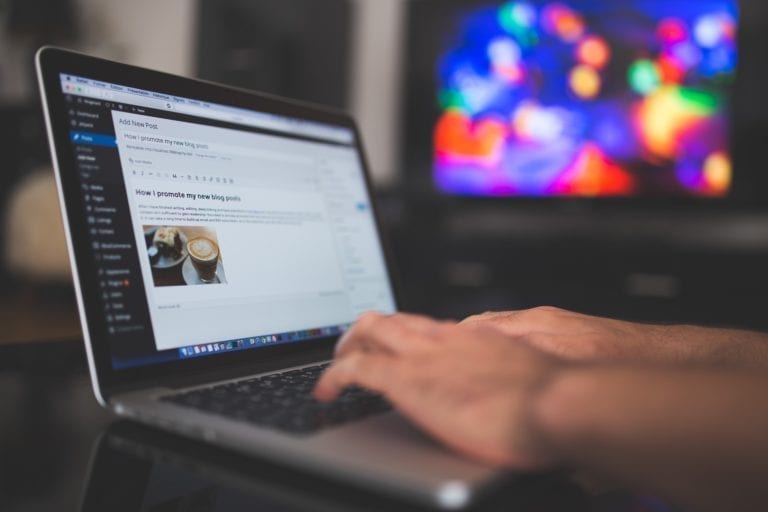 A person working on a website on a laptop