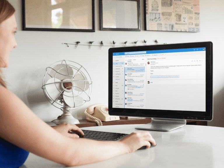 a woman checking her mail on a desktop