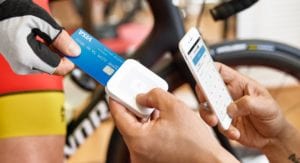 A person paying with his debit card