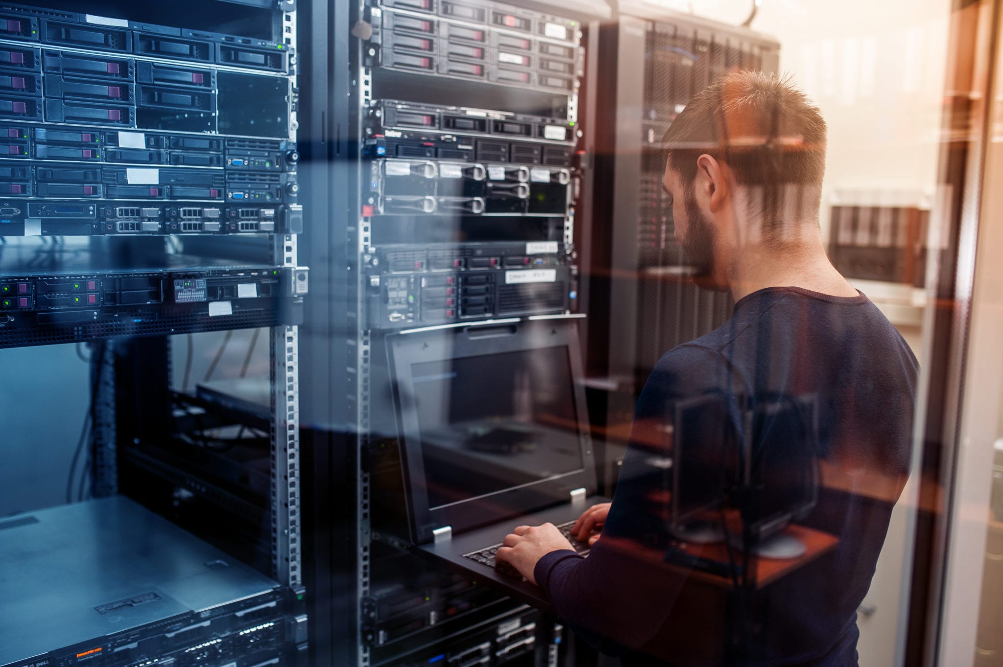 IT technician working on server maintenance in a data centre