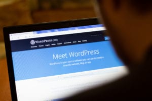 Laptop screen displaying the WordPress.org website homepage