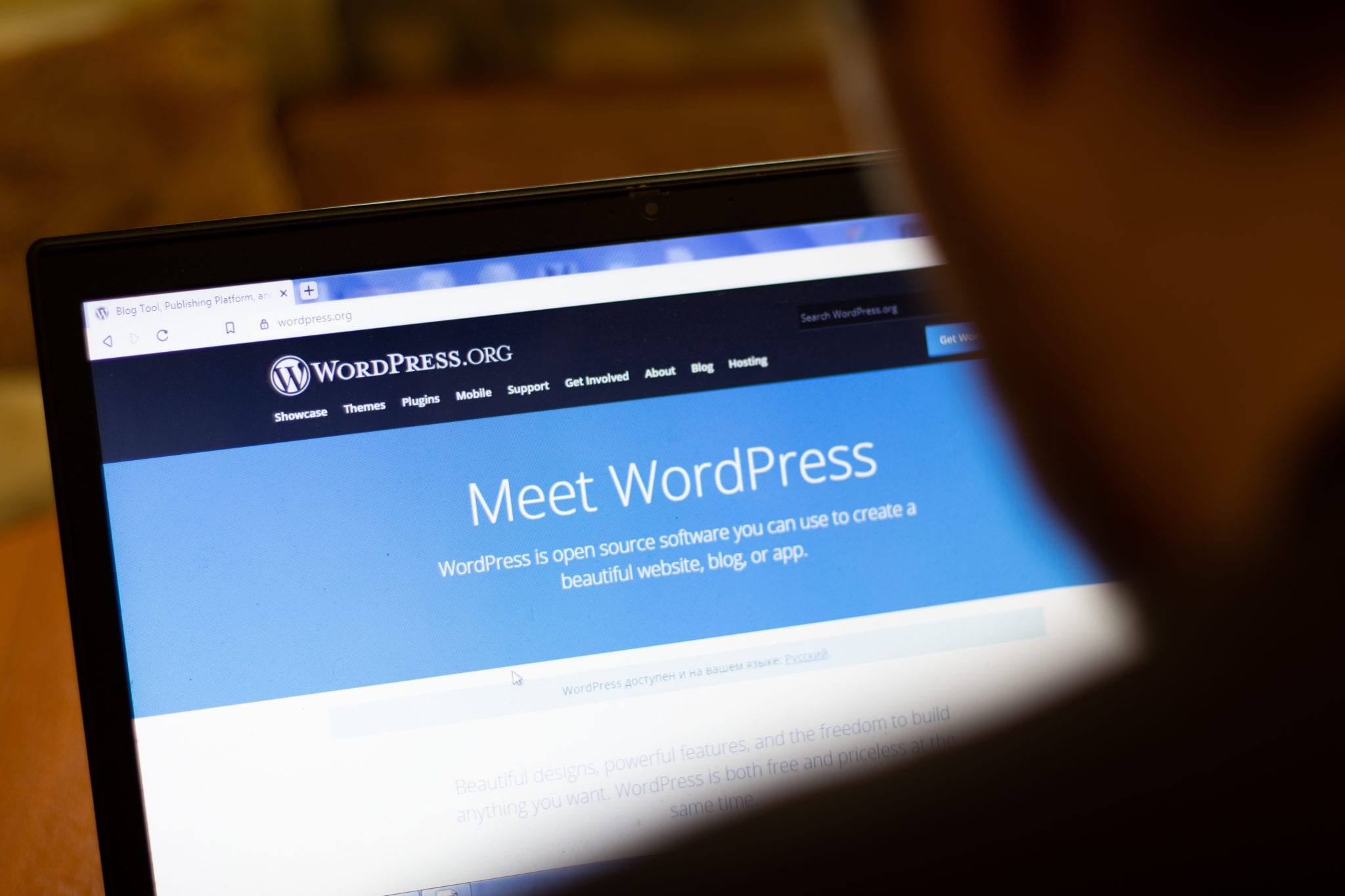 Laptop screen displaying the WordPress.org website homepage