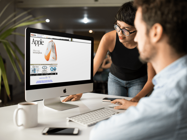 awoman and a man working on a desktop