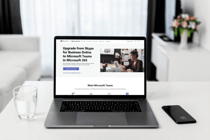 Laptop displaying Microsoft 365 webpage prompting upgrade from Skype for Business Online to Microsoft Teams