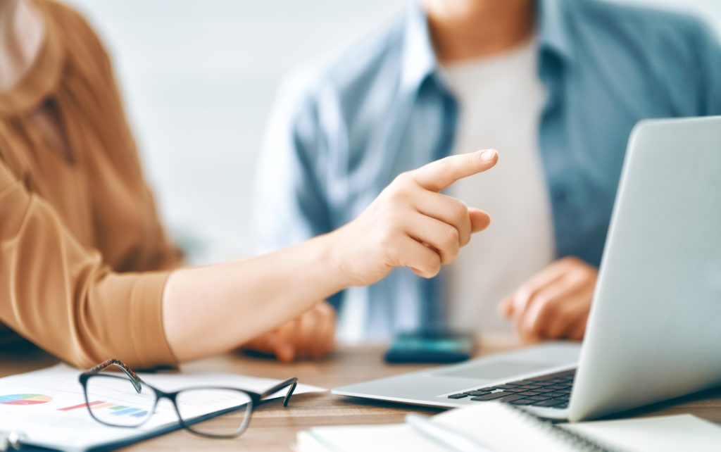 two people working with a desktop