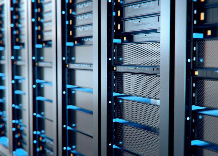 Close-up of secure server racks with blue indicator lights used for managed website hosting by O'Brien Media