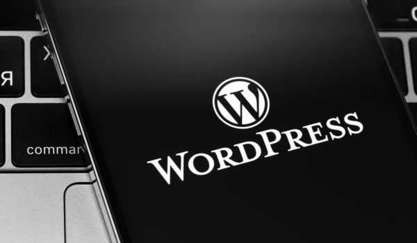 WordPress app logo on the screen smartphone closeup. WordPress