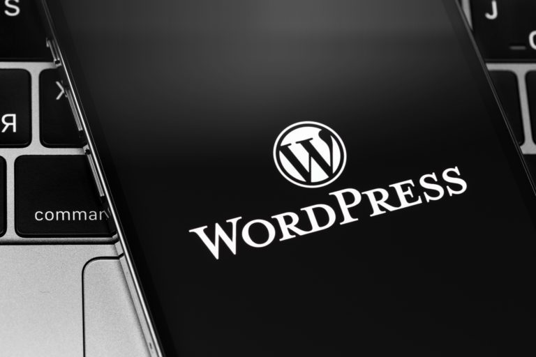 WordPress app logo on the screen smartphone closeup. WordPress
