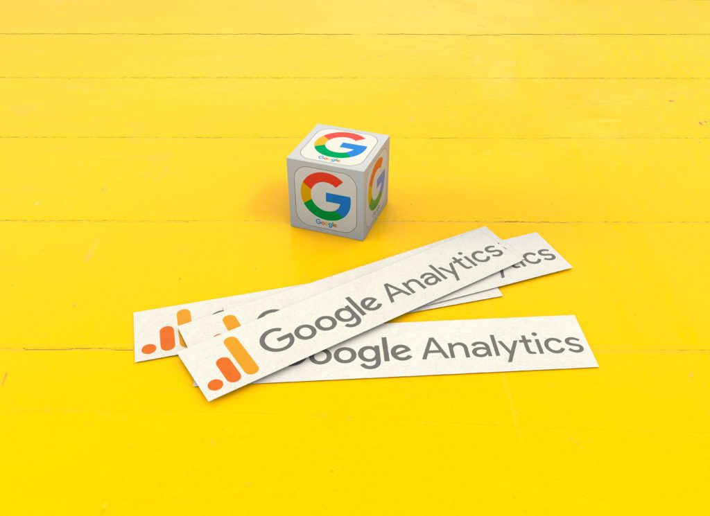 Google Analytics stickers and a cube with Google logos
