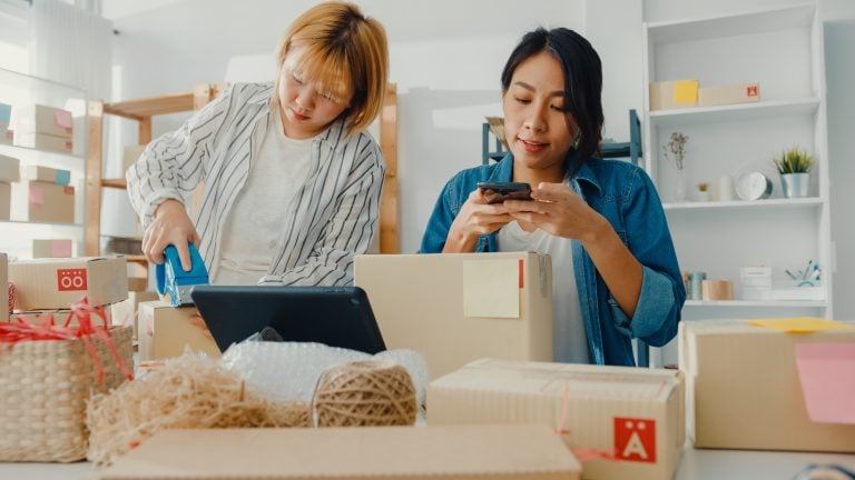 Young Asia businesswomen using mobile phone call receiving purch