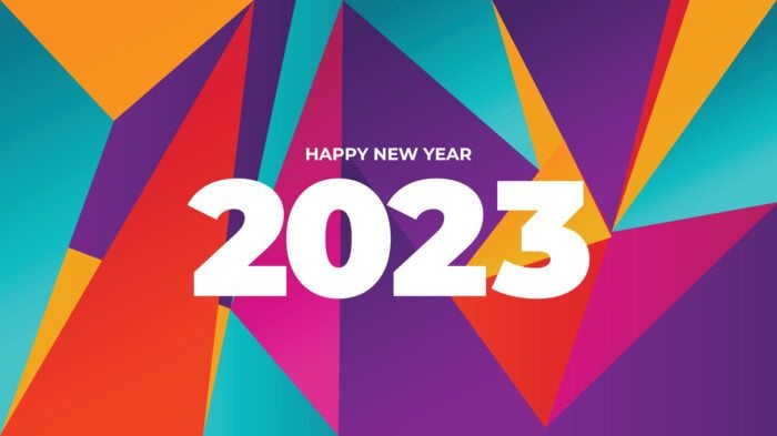 Vibrant geometric shapes with Happy New Year 2023 text in bold white