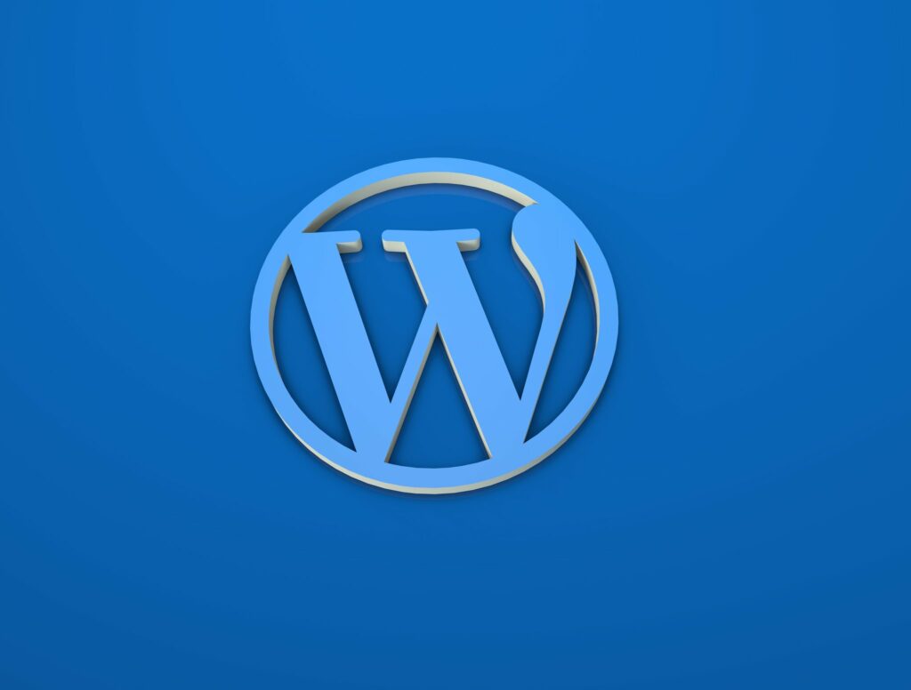 Blue 3D WordPress logo on a solid background representing WordPress update version 6.2.