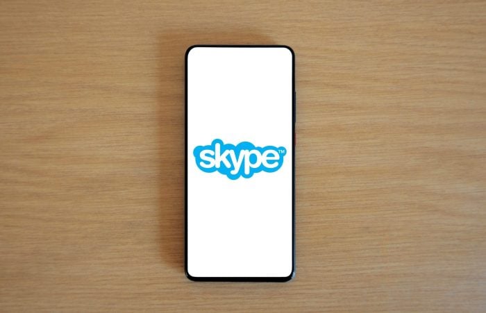 Smartphone screen showing the Skype logo on a blue background