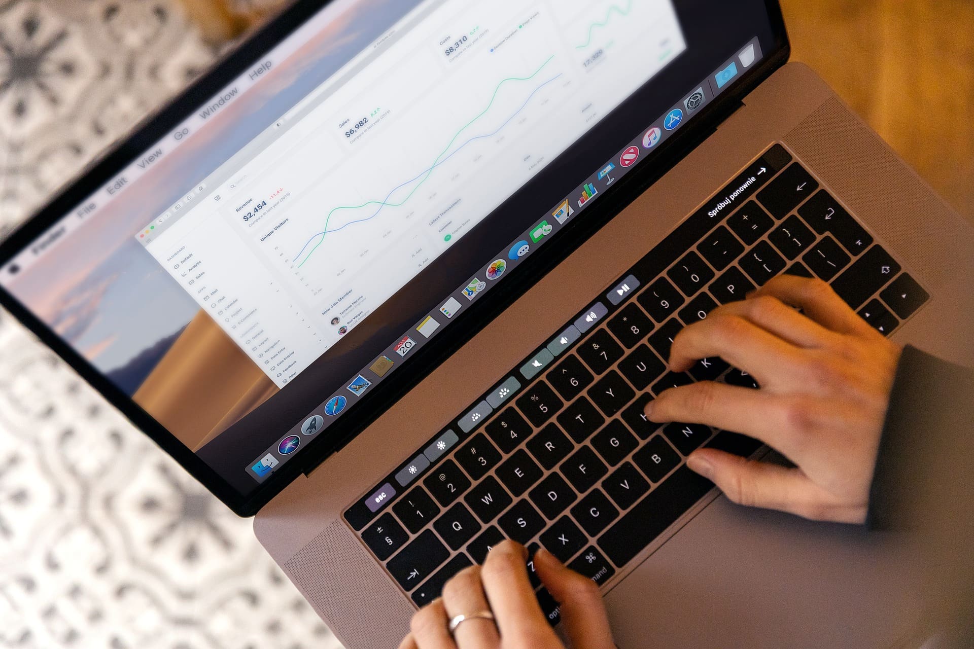 Laptop being used by a woman to review data